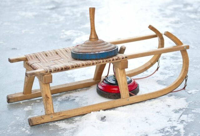 curling and carriage skid on ice surface